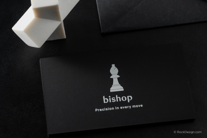 Black hard suede business card with bold white UV print and minimalistic design