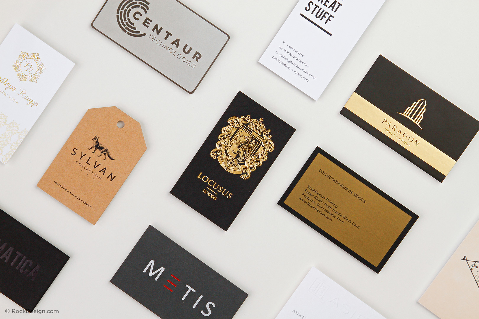 Multiple luxury business card styles displayed on table